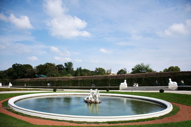 Classic retro vintage antique fountain and statue for Austrians people and foreign travelers travel visit in garden of Belvedere Palace or Schloss historic building complex museum in Vienna Austria