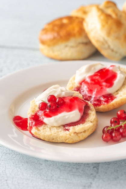 Classic scones with cream and berry jam