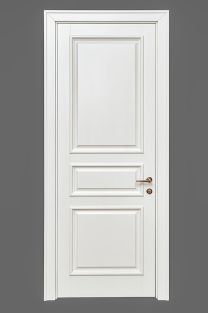 Photo classic style white door white interior door with golden handle isolated on gray background