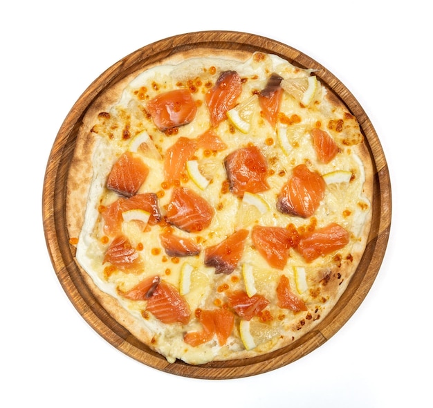 Classic thin pizza with mozzarella salmon and lemon slices on a white background