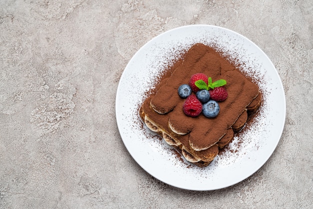 Classic tiramisu dessert with berries