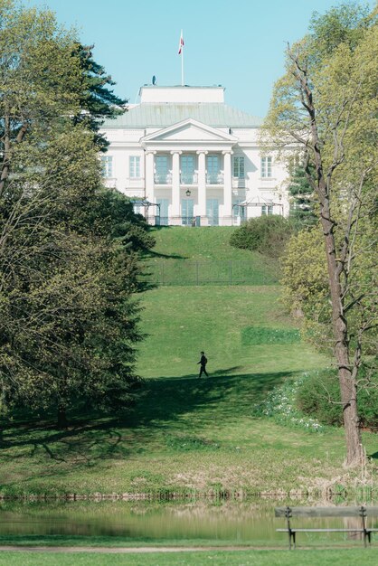 The classical building on the hill above the lake in the spring