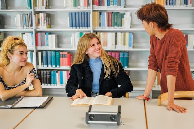 Classmates studying together in the university library