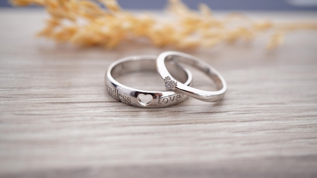 Classy silver wedding rings made of white gold engraved LOVE