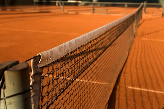 Clay (Dirt) Tennis Court, under the sunset.