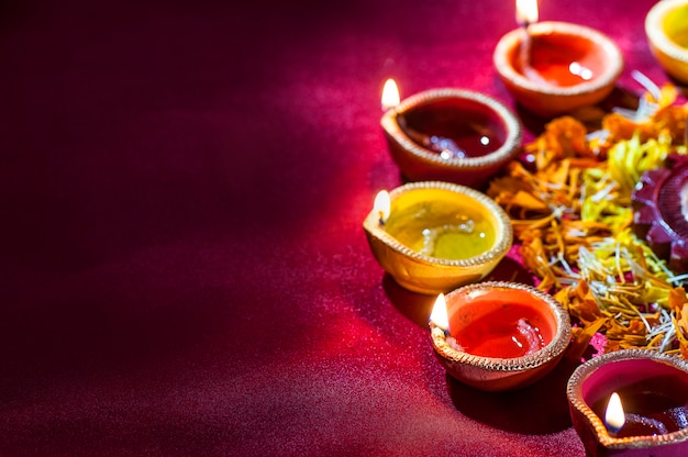 Clay diya lamps lit during Diwali Celebration. Greetings Card Design Indian Hindu Light Festival called Diwali