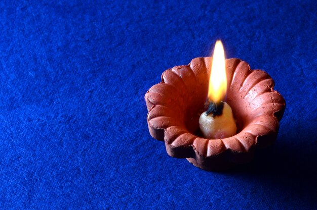 Clay diya lamps lit during diwali celebration. Greetings Card Design Indian Hindu Light Festival called Diwali