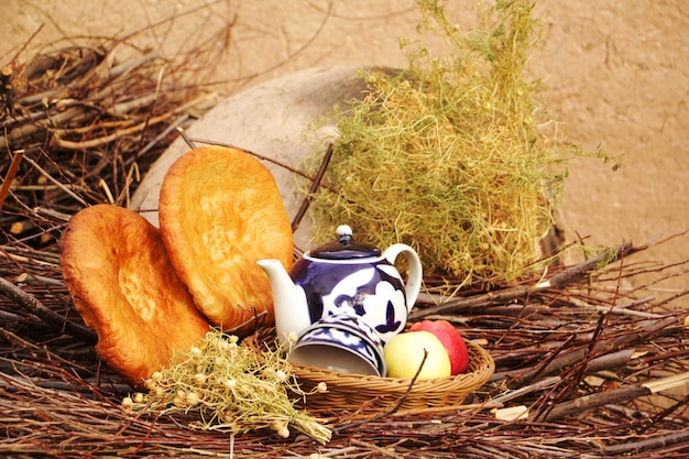 Clay oven cakes and tea in nature