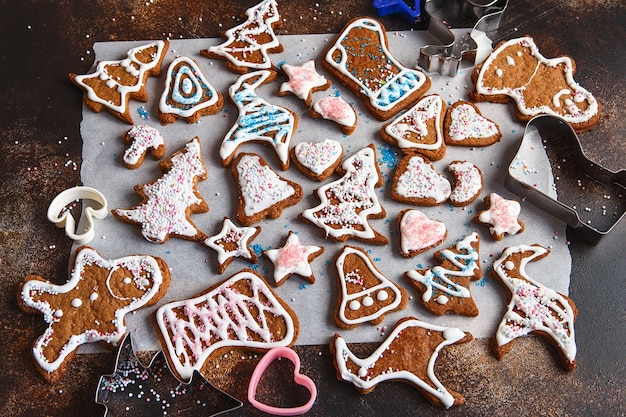 clazed decorating gingerbread homemade cookies for christmas. top view of cookies on table