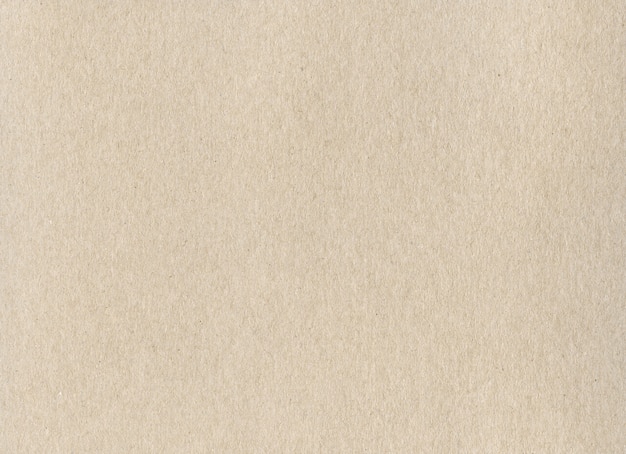 Clean beige kraft cardboard paper background texture.