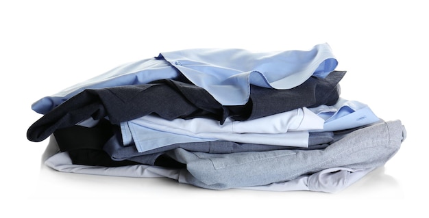 Clean clothes from drycleaning on white background