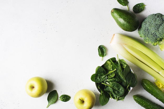 Clean eating green ingredient avocado spinach broccoli apples and cucumber