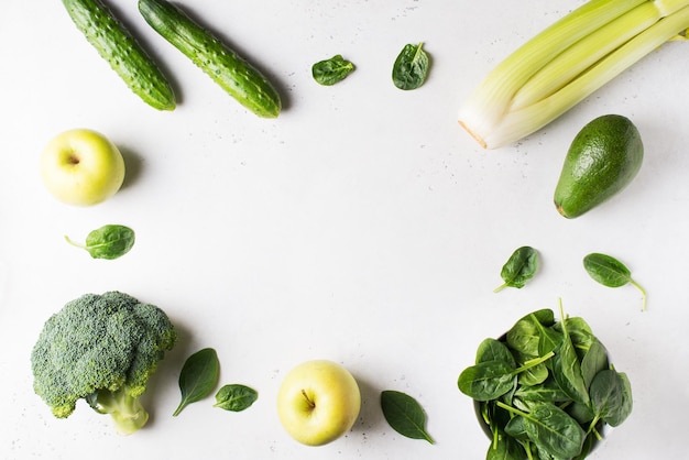 Clean eating green ingredient avocado spinach broccoli apples and cucumber