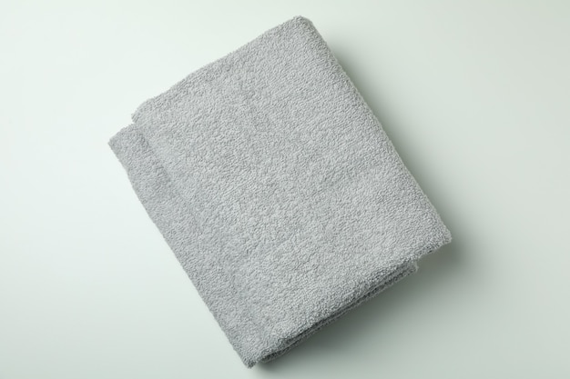 Clean folded towels on light gray