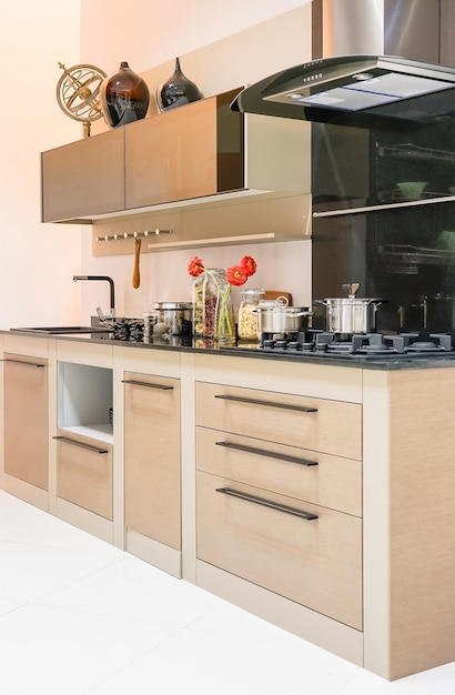 clean kitchen interior with stainless steel appliances in a luxury apartme