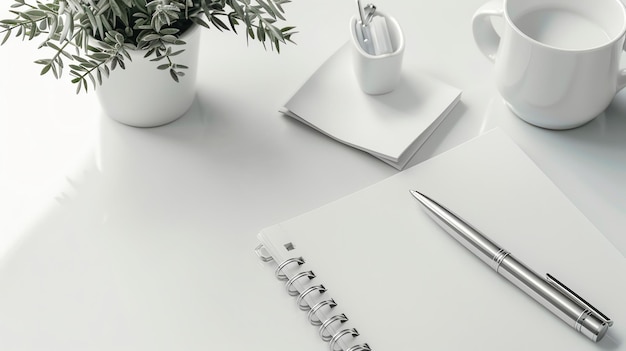 Clean modern desk with a blank notebook pen and plant