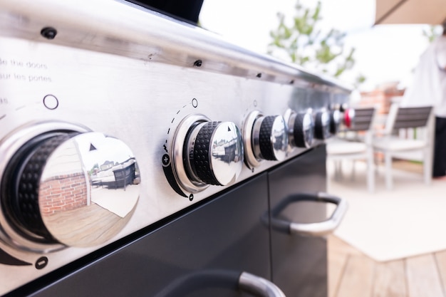 Clean six-burner gas grill ready for summer grilling.