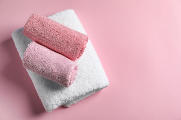 Clean towels on color background