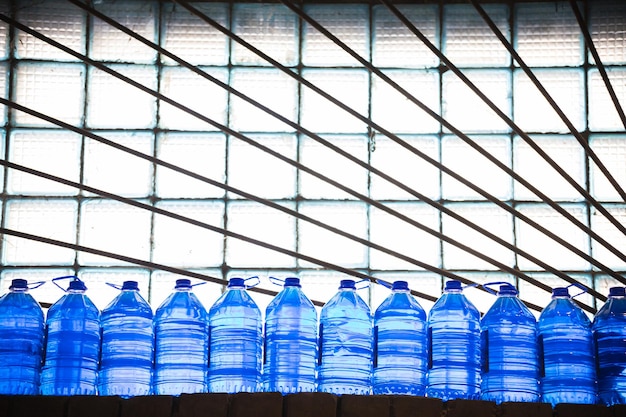 Photo clean water in plastic bottle moves through conveyor factory