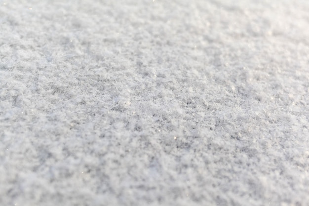 Clean white snow closeup Winter background Snow surface Fresh fluffy white snow texture