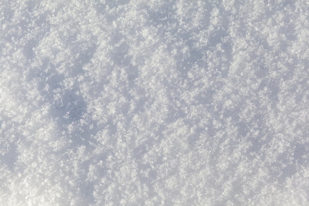 Clean white snow closeup Winter background Snow surface Fresh fluffy white snow texture