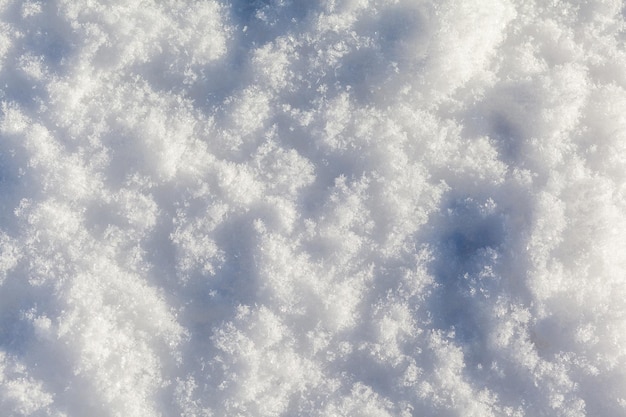 Clean white snow closeup Winter background Snow surface Fresh fluffy white snow texture