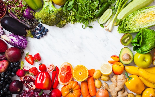 Cleaneating food frame with copy space Top view of vegetables and fruits isolated on white Healthy eating and diet concept