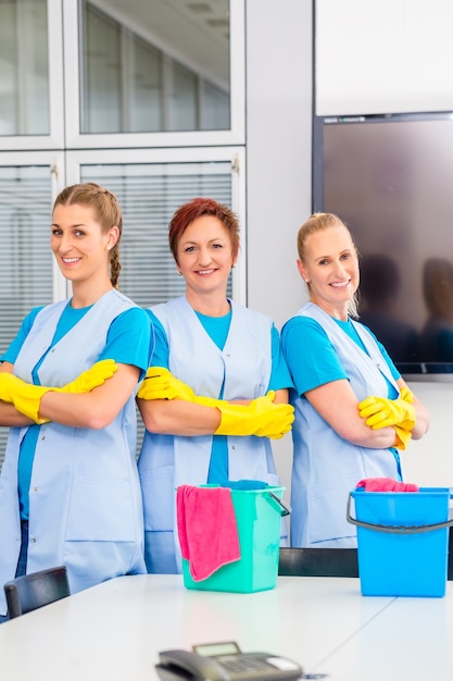 Cleaning brigade working in office