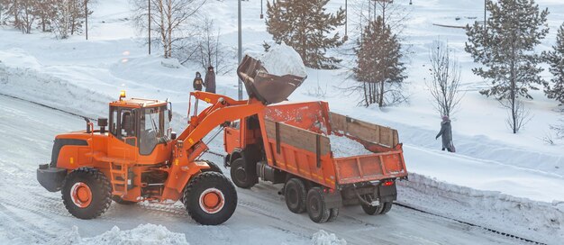 Cleaning and cleaning of roads in the city from snow in winter