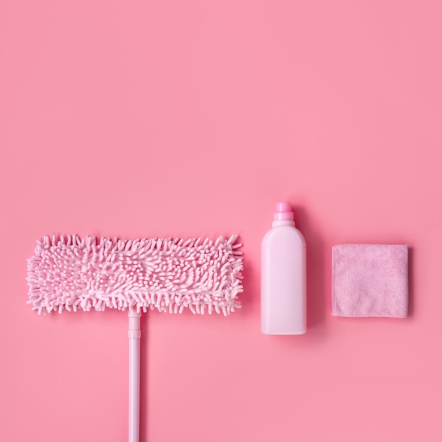 Cleaning kit in the house pink on a pink background