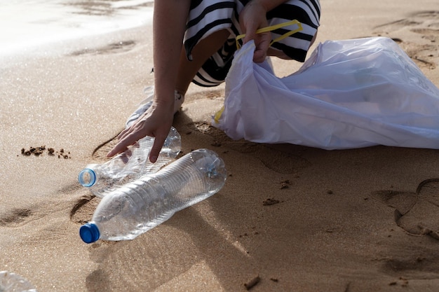 Cleaning plastic on the beach