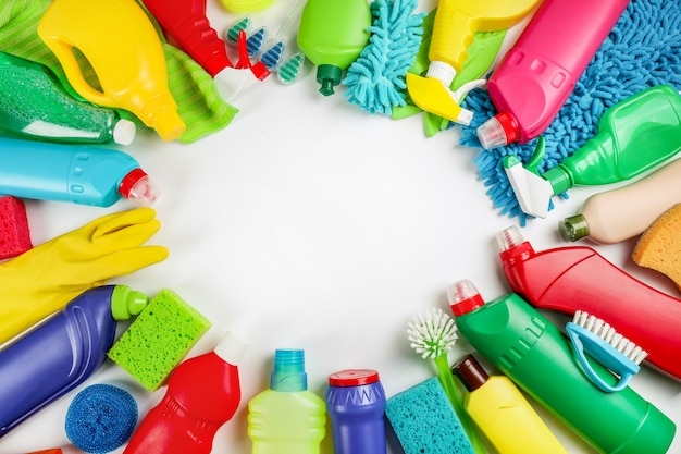 Cleaning products on white background. Home cleaning concept. Top view