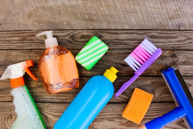 Cleaning products on wooden background. 