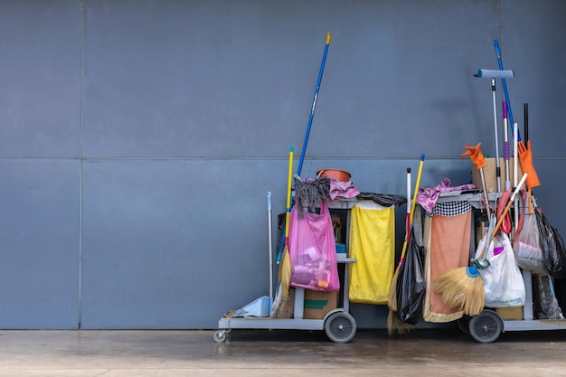 Cleaning set and equipment beside the grey wall at the building