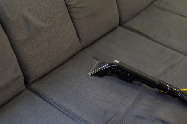 Cleaning Sofa With Vacuum Cleaner