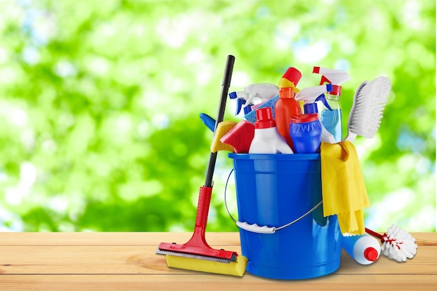 Cleaning supplies collection in plastic bucket