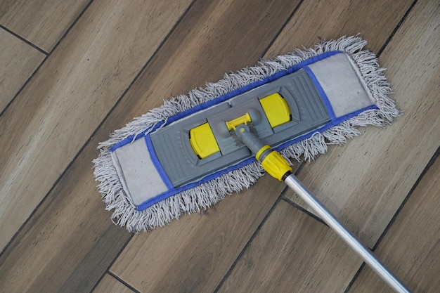 Cleaning tiles floor with mop