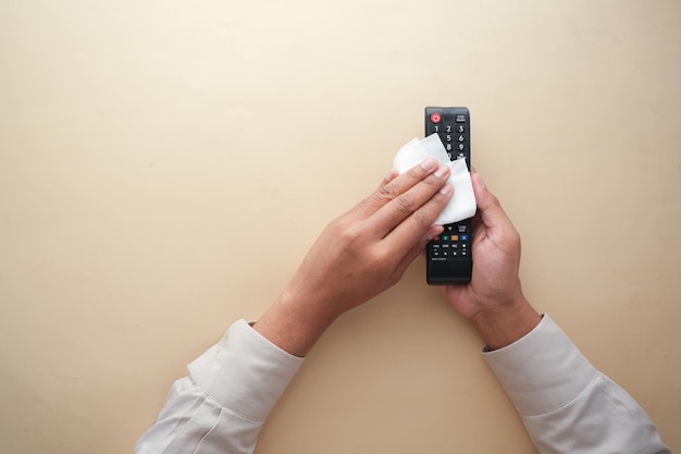 Cleaning Tv remote control with an antibacterial fabric tissue