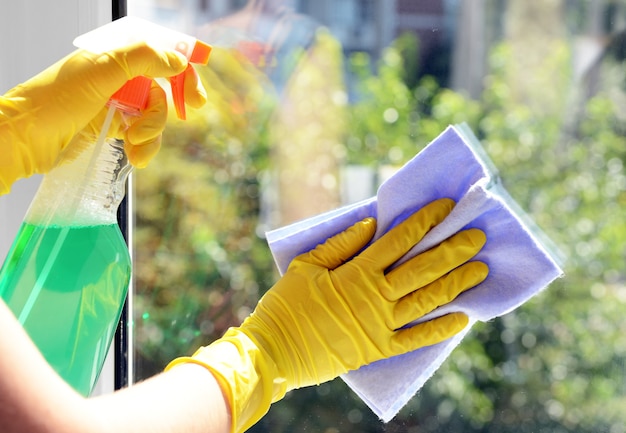 Cleaning windows with special rag and cleaner