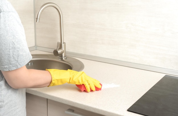 Cleaning woman gloves hands cleaning kitchen Cleaning home table sanitizing kitchen table surface Deep Cleaning service copy space