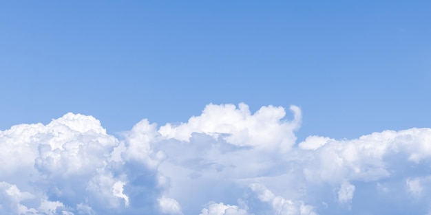 Clear blue sky and beautiful white clouds Summer season Cumulus cloud natural background Panoramic cloudscape Abstract wallpaper heaven pattern Wide banner