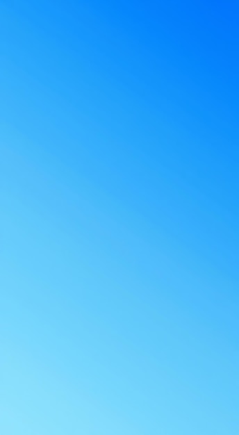 Photo a clear blue sky with a gradient of color from light blue to dark blue