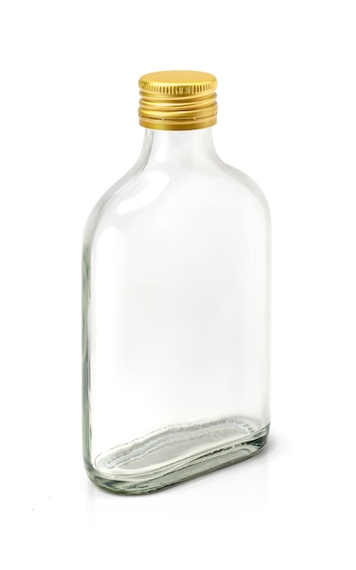 Clear glass bottle with brass cap isolated