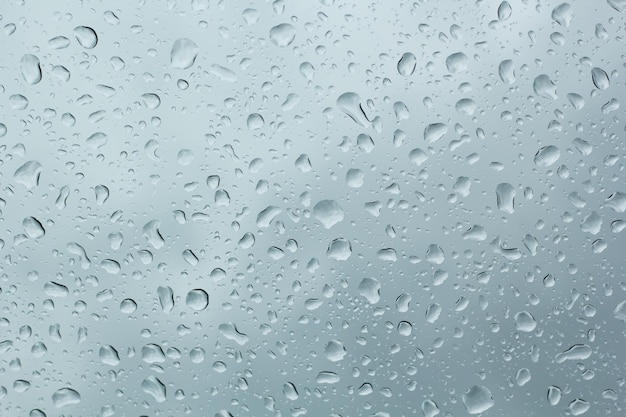 A clear glass with rain drops on it