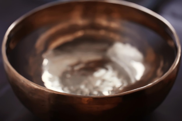 clear water in a golden bowl / clear water in a yellow iron bowl