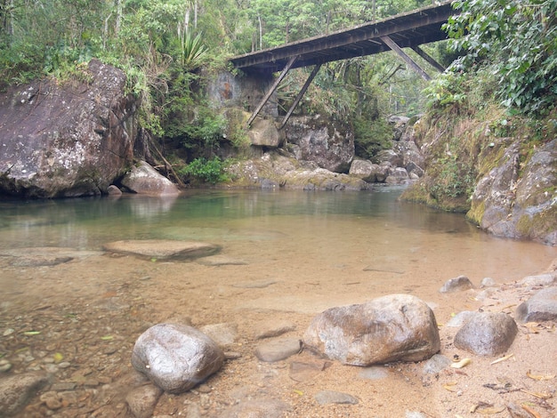 Clear water river flowing over a bridge in Brazil