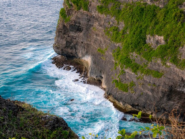 Cliff face with blue ocean waves