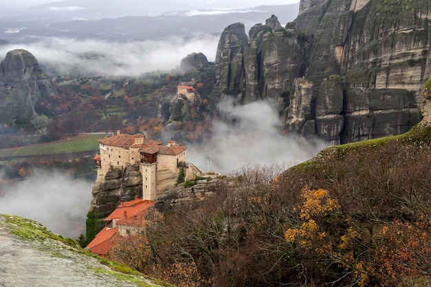 The cliffs shrouded in fog on which the monasteries Thessaly GreeceTrikala