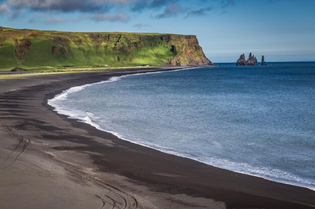 Cliffs and small bay in Iceland in summer