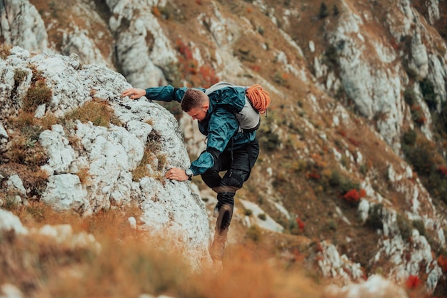 Climber overcoming a difficult climbing route on the rock mountain Adventure extreme sport outdoor